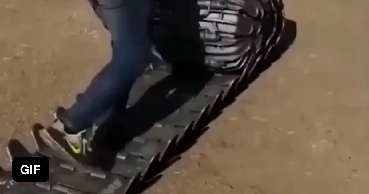 Putting on tire grips for traction. 9GAG