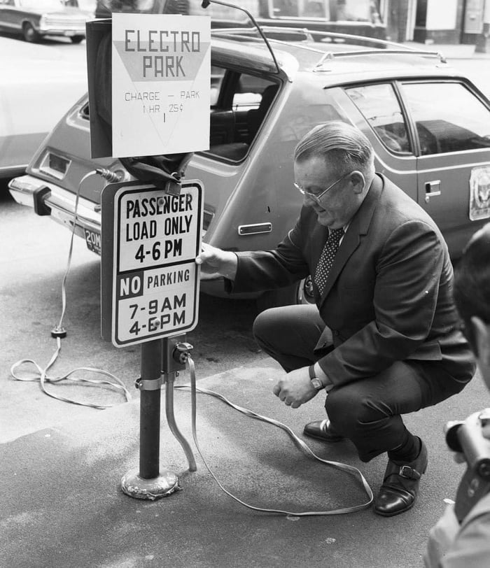 Man charging an electric AMC Gremlin. Seattle, USA, 1973. 9GAG