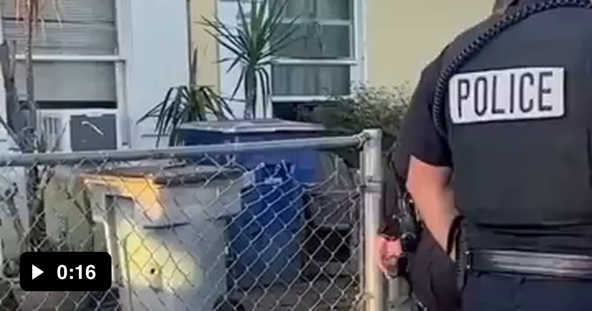 Police officer rescues distressed dog stuck in doorway. - 9GAG