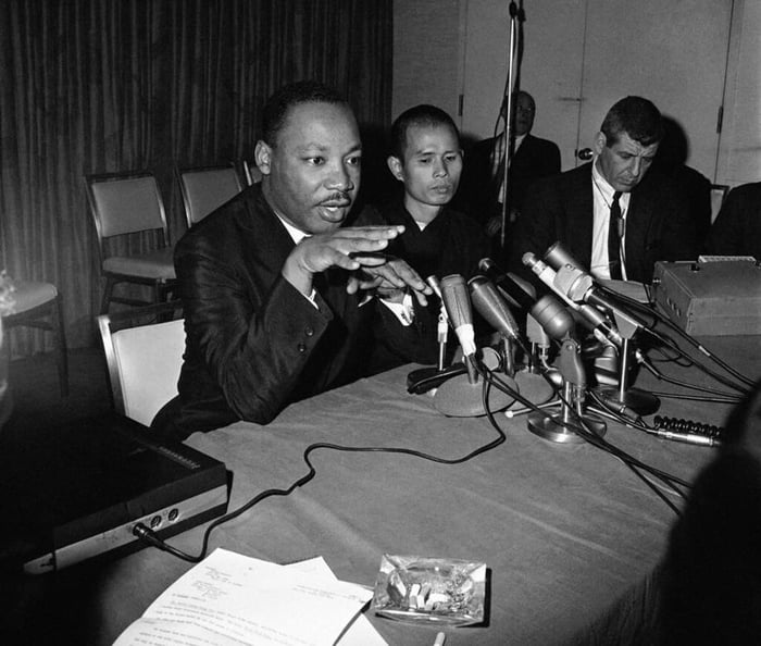 Thich Nhat Hanh with Dr. Martin Luther King Jr. (left corner), during a ...