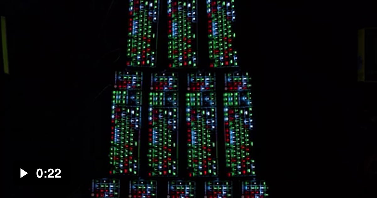 Built a giant RGB keyboard Christmas tree and synced them all. 60