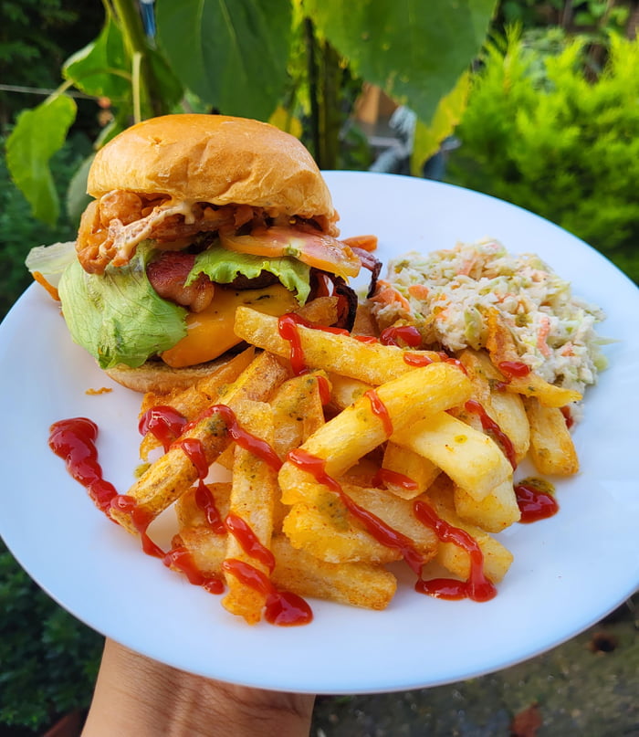 Homemade double fried chips, coleslaw and burger with crispy onions and