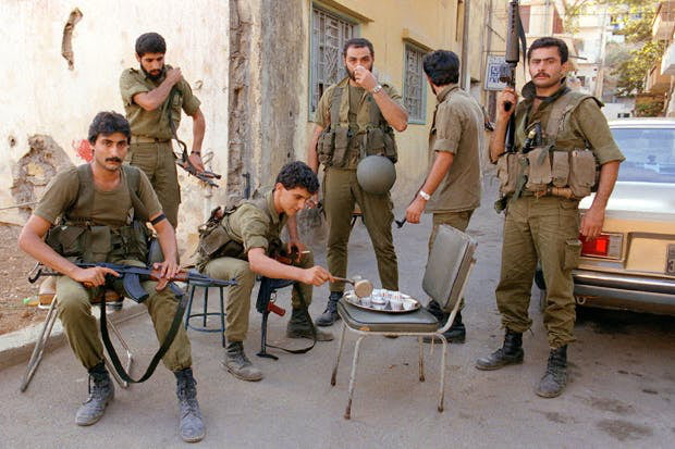 Lebanese Forces soldiers about to drink coffee, before defending their ...