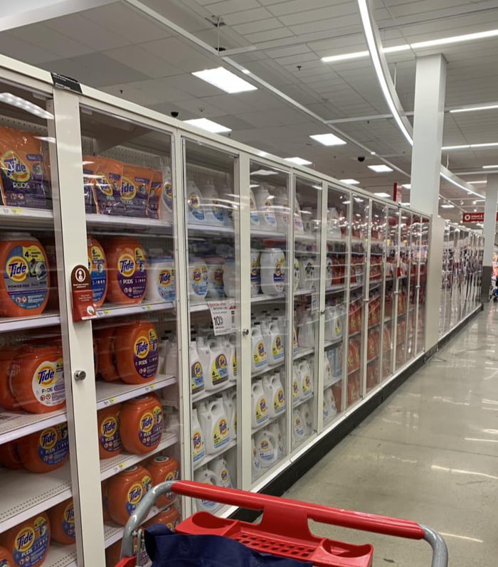 Entire aisle of detergent locked in antitheft case. Socks and