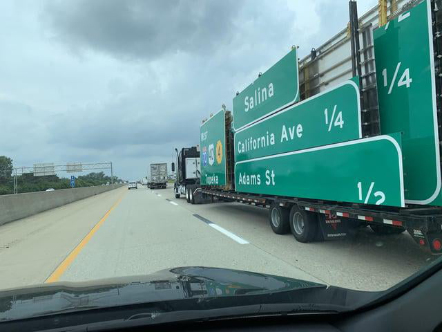This is a truck carrying the signs you see on the interstate - 9GAG