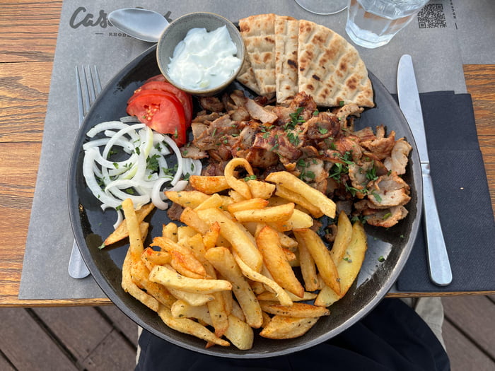Pork gyros with chips, onions, tomatoes, flatbreads and tzatziki 9GAG