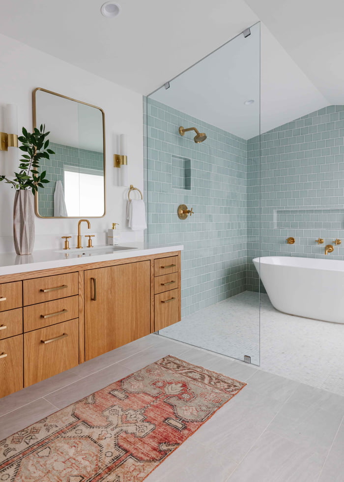 Tub inside a tiled shower with brass fixtures, Houston, Texas 9GAG