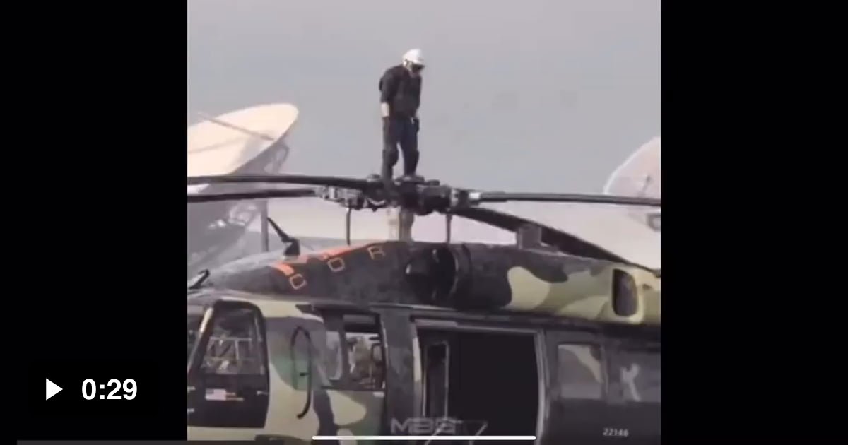 Guy stands on the top of spinning helicopter rotor 9GAG