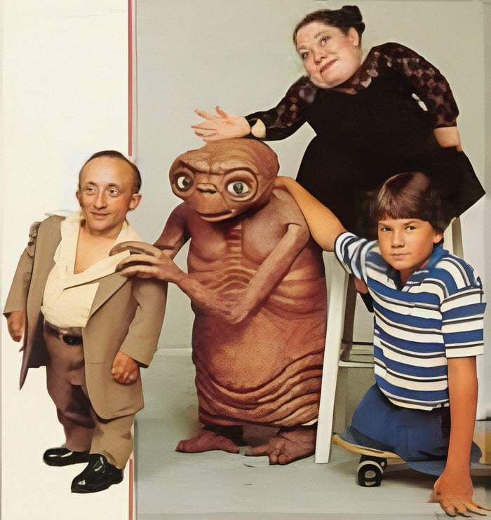 E.T. and the three actors from inside the costume. Tamara De Treaux and ...