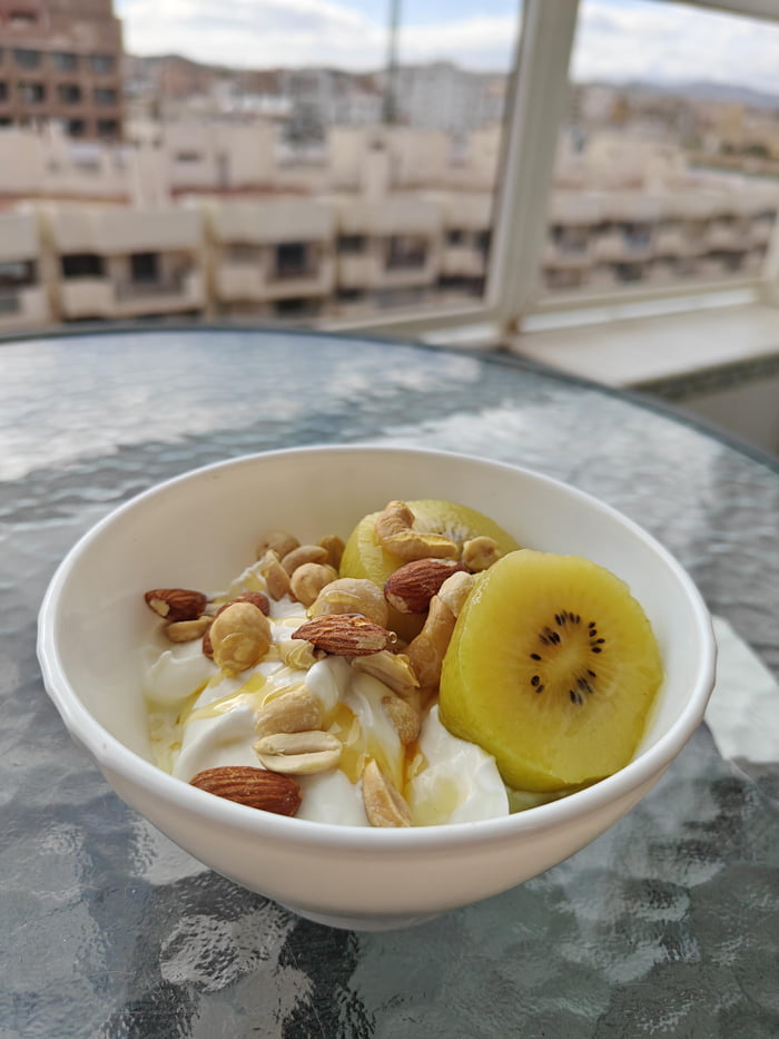 A simple breakfast Greek yogurt, kiwi, mixed nuts, and honey 9GAG
