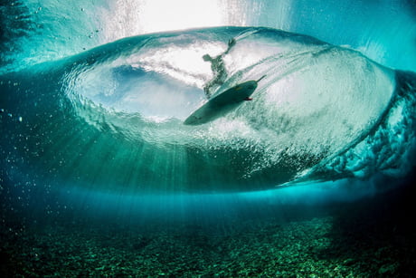 Underwater Photograph Of A Surfer Riding A Wave Taken From The