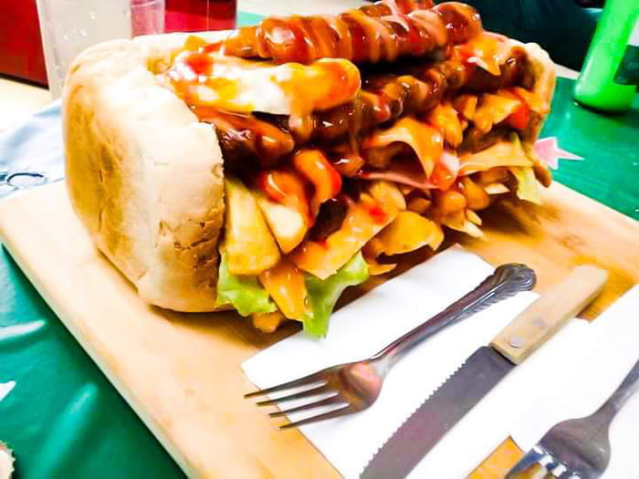 Kota, a loaf of bread stuffed with sausage, cheese, eggs, fries