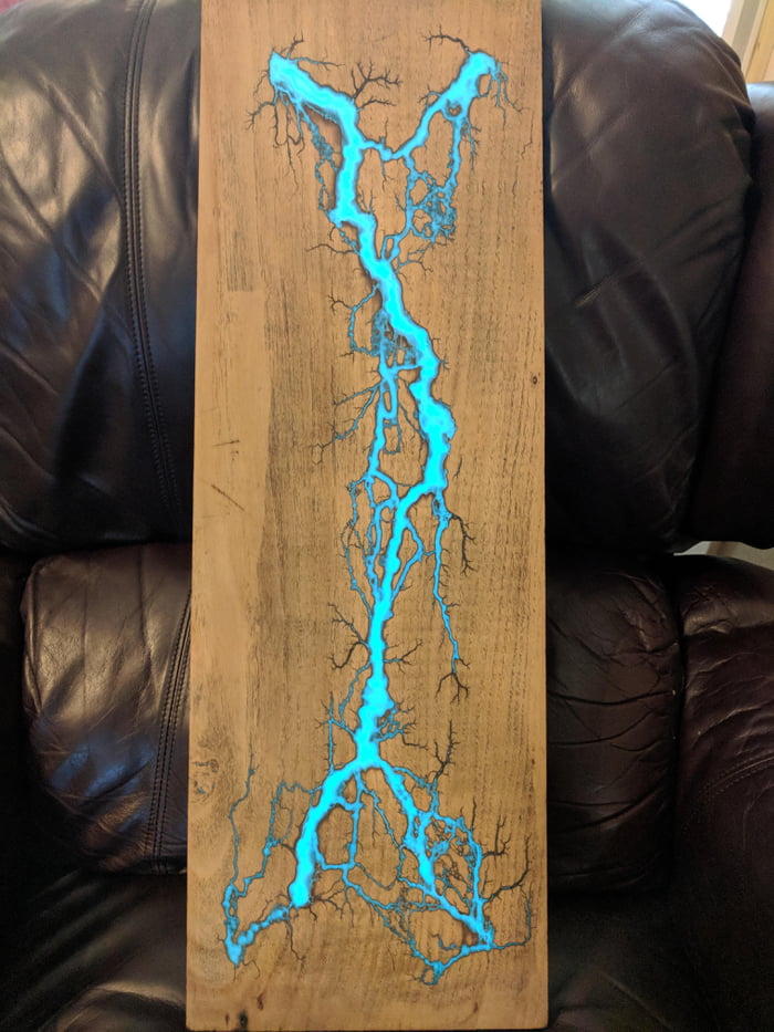 Fractal wood burn with photolumimescent resin inlay in reclaimed oak