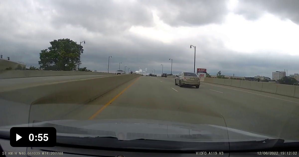 Unprovoked driver stops in the middle of a busy freeway to approach car ...