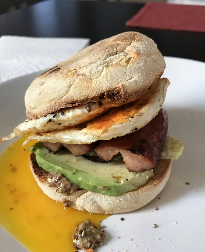 Andouille sausage, fried eggs, & avocado on a cheddar English muffin 9GAG