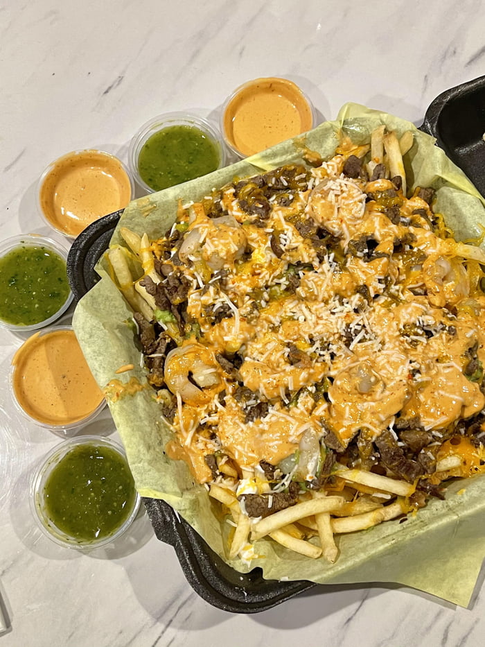 Midnight munchies Carne asada fries with garlic shrimp, guacamole