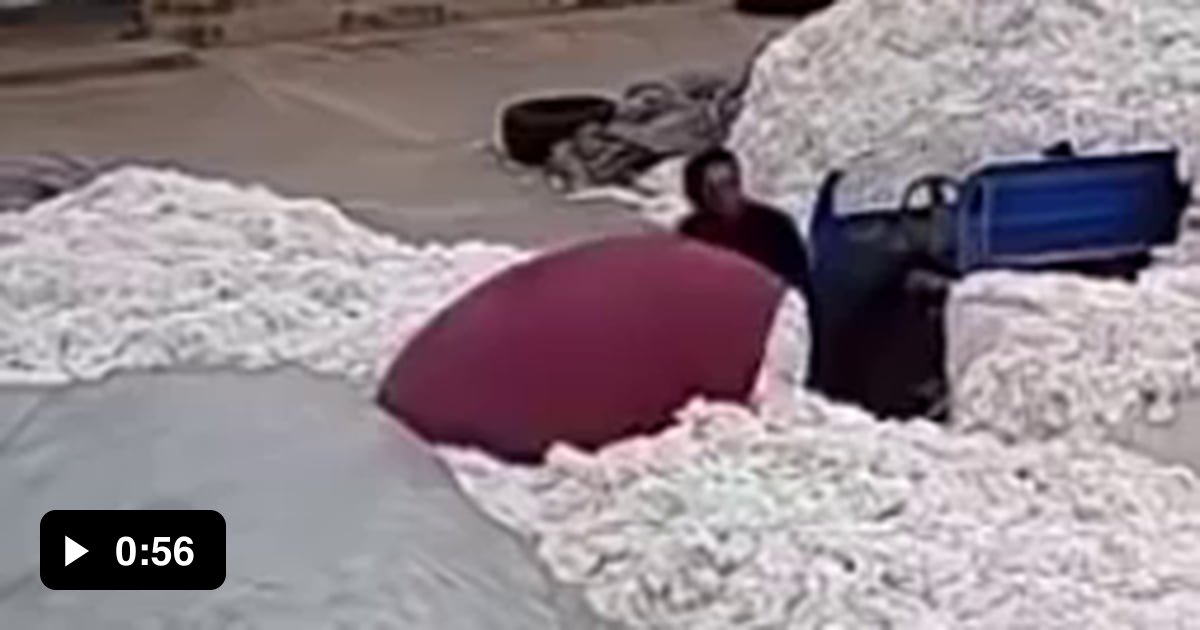 Guy uses lighter to open plastic bag at cotton factory. 9GAG