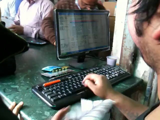 This receptionist at a busy pharmacy in India (before COVID)