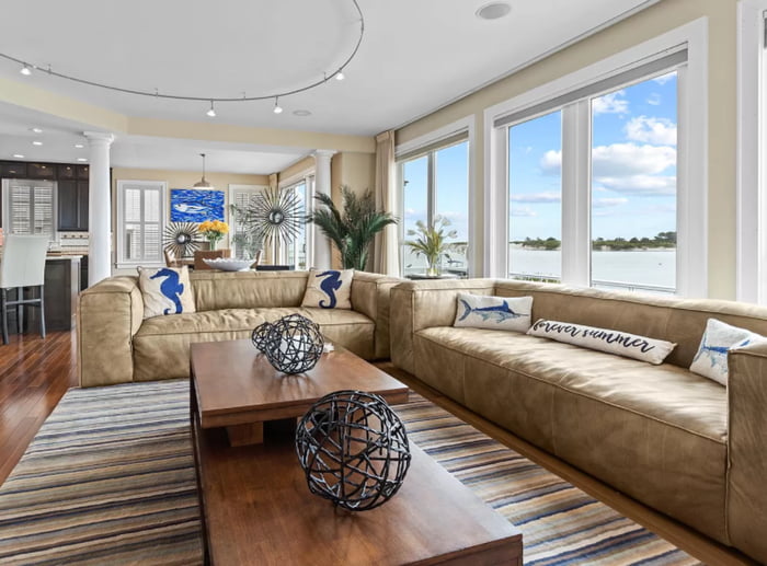 Breezy Coastal Living Room With Wide Angle Views Of Assateague Island