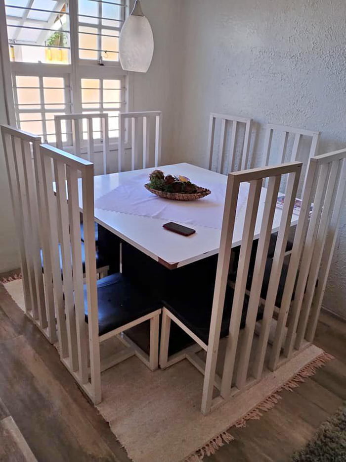 These chairs that look like a fence (also too many chairs for such a small table) 9GAG