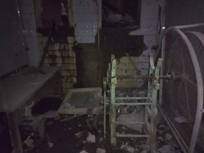 Door of this room were closed with nails and rusty wires.floor is wet