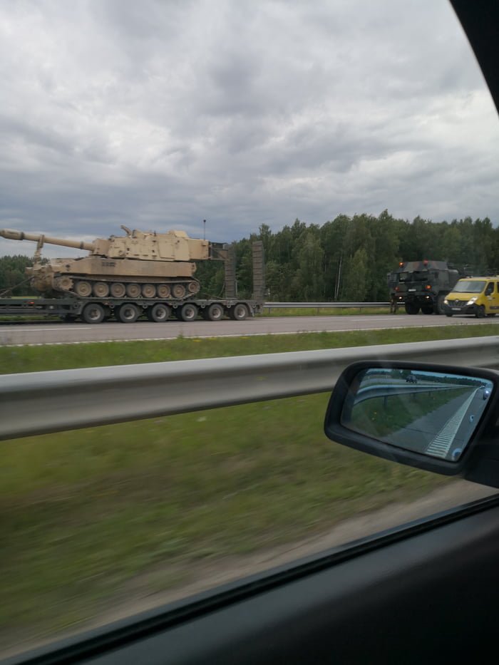 5 paladin support vehicles and infantry carriers moving through