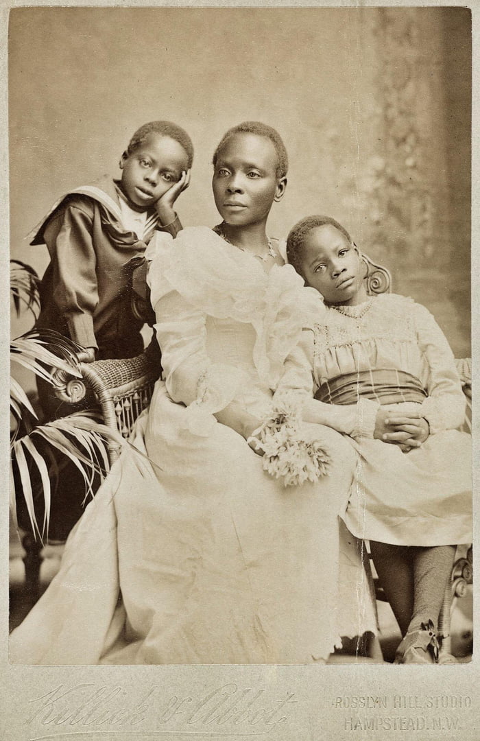 Photograph of Mrs Victoria Randle, with her two children, taken in a ...