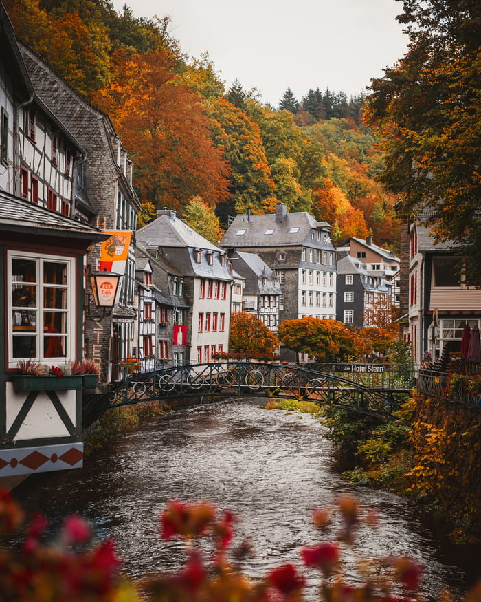 Narrow Rur River Flowing Through The Resort Town Of Monschau In The 