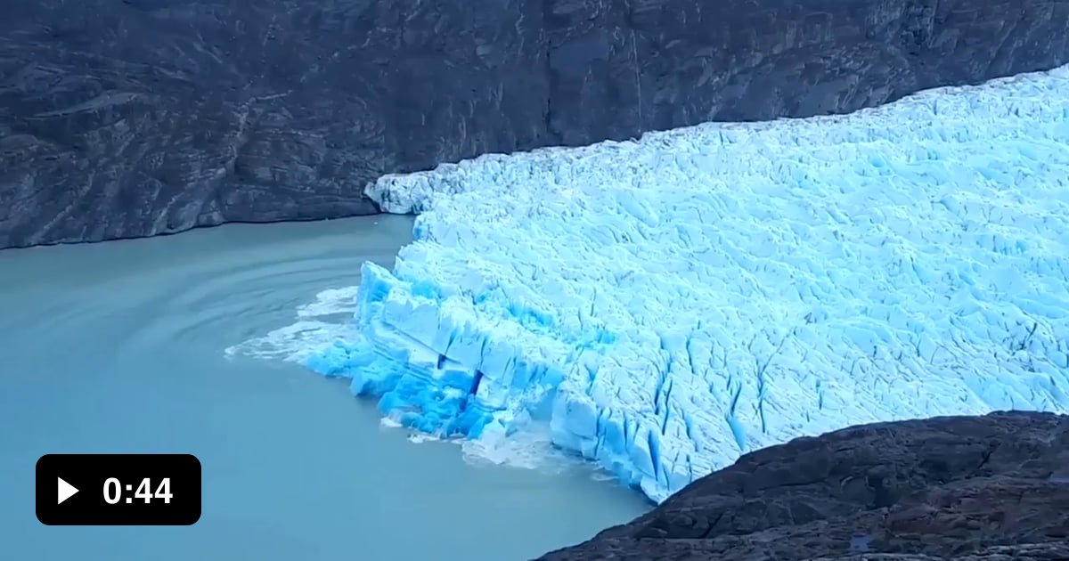 Compressed Ice Glacial iceberg shifts revealing the deep blue of older, compressed ice ...