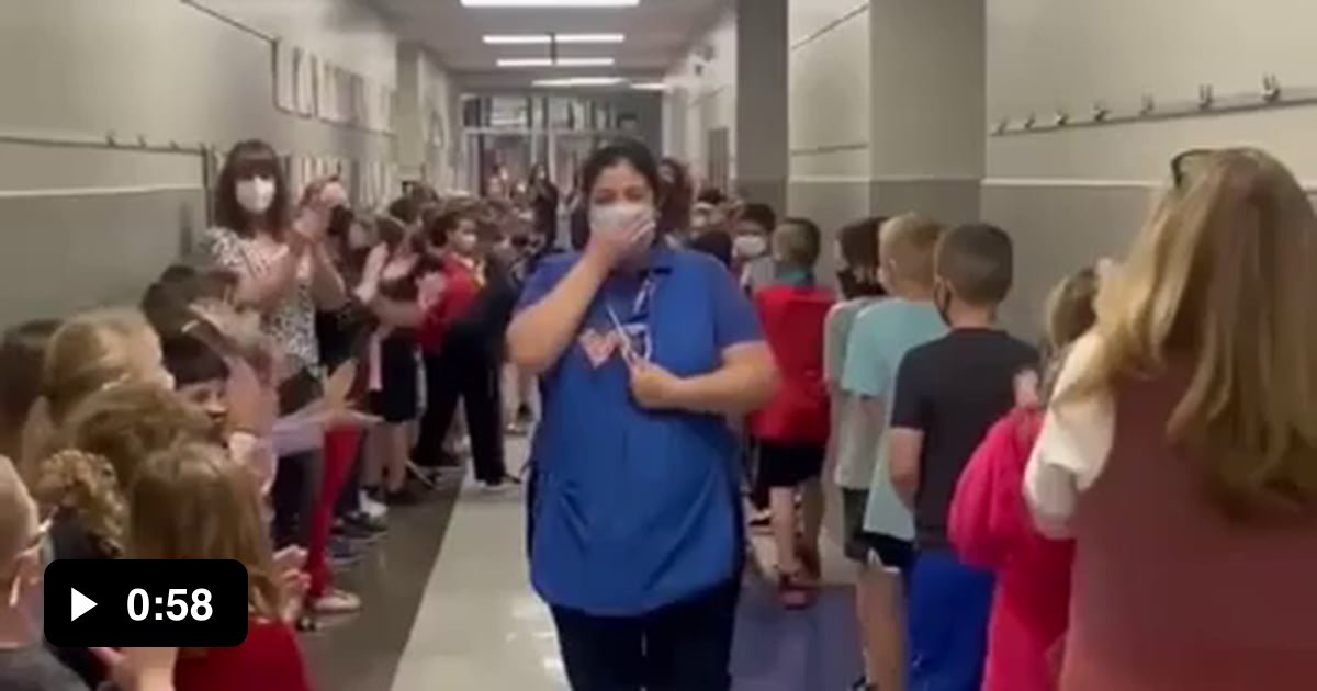 Students and staff at an Oklahoma elementary school lined the hallways ...