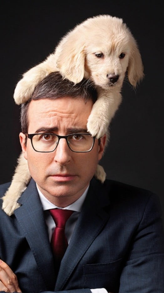 John Oliver with a puppy on his head 9GAG