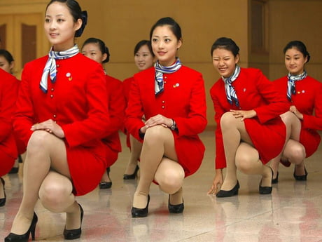 Cathay Pacific Flight Attendents Training Elegance When Squatting