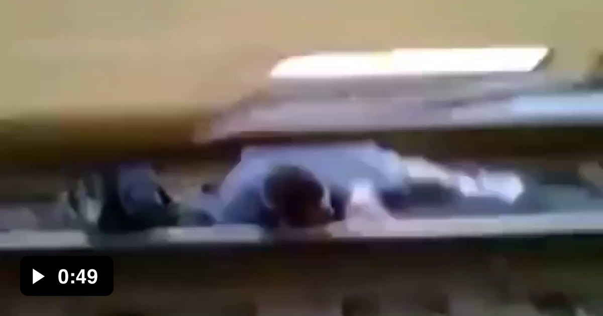 Guy gets stuck underneath a moving train 9GAG