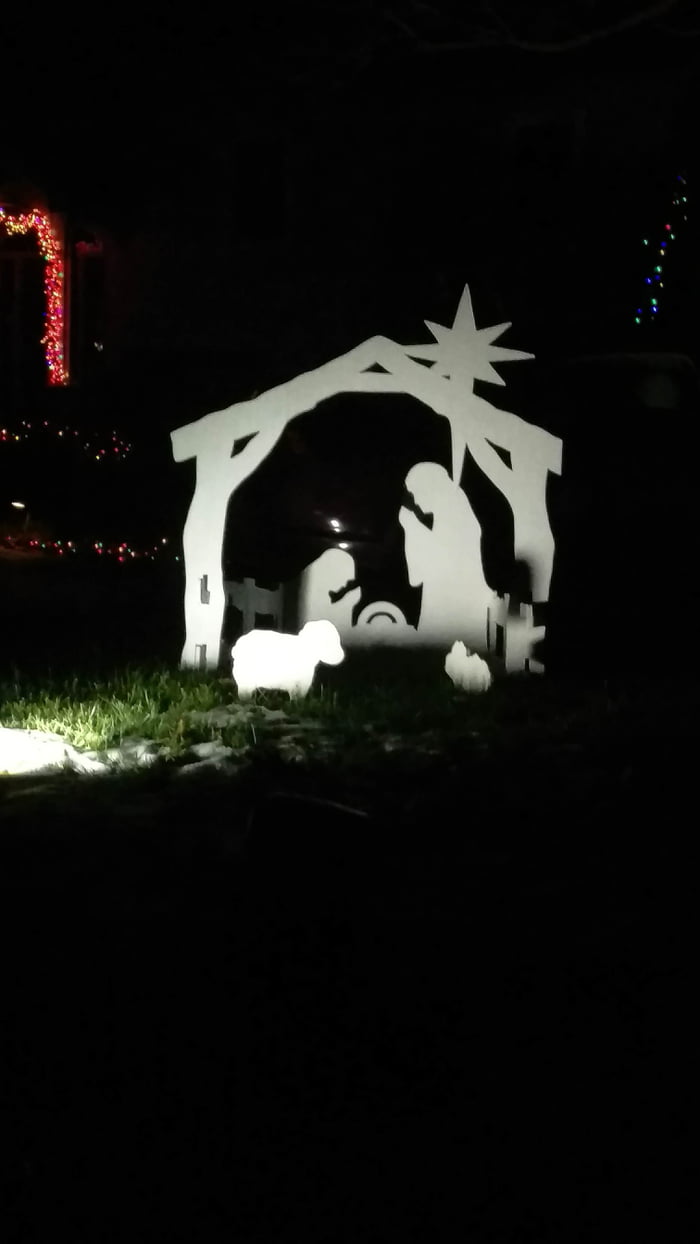 My neighbors have the "trex fighting over a table saw" nativity scene