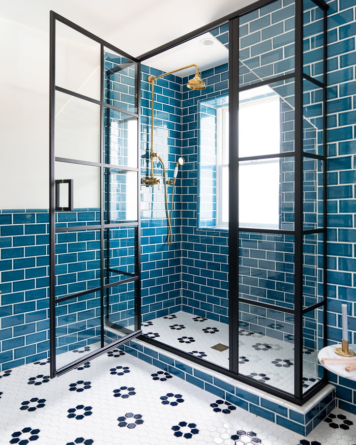 black-framed-shower-in-a-blue-tiled-bathroom-of-a-beach-house-bellport