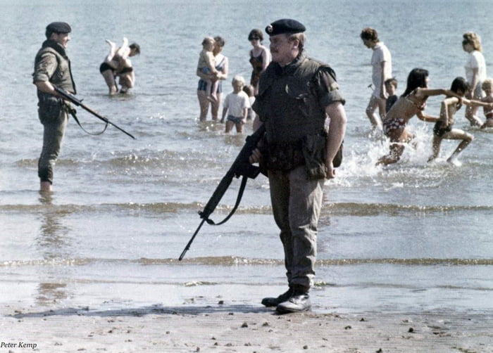 British troops stand guard on a beach near Belfast, Northern Ireland’s ...