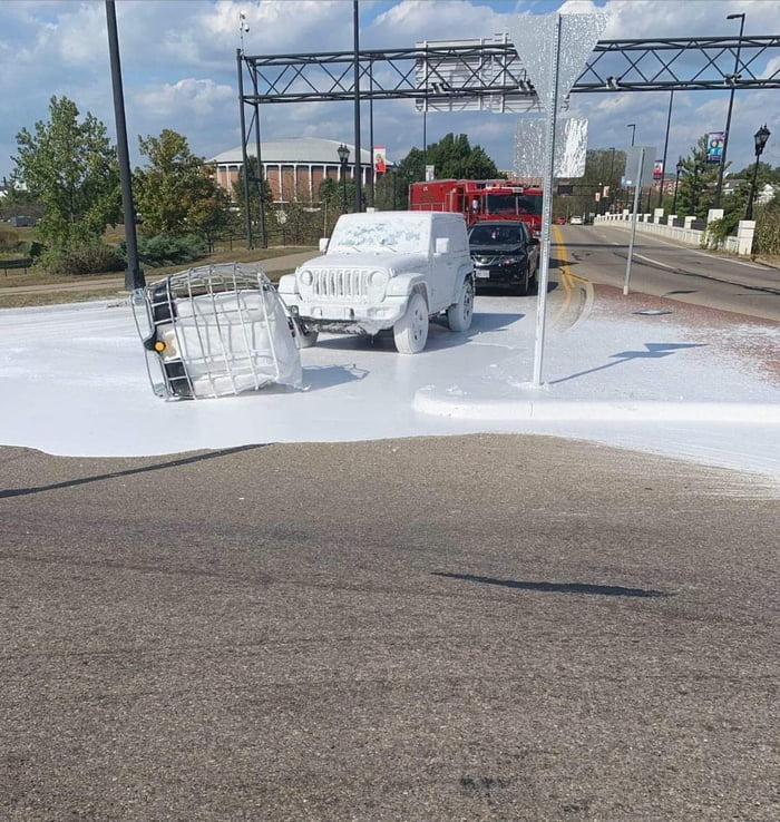 Road marking paint fell off a truck, covering this Jeep 9GAG