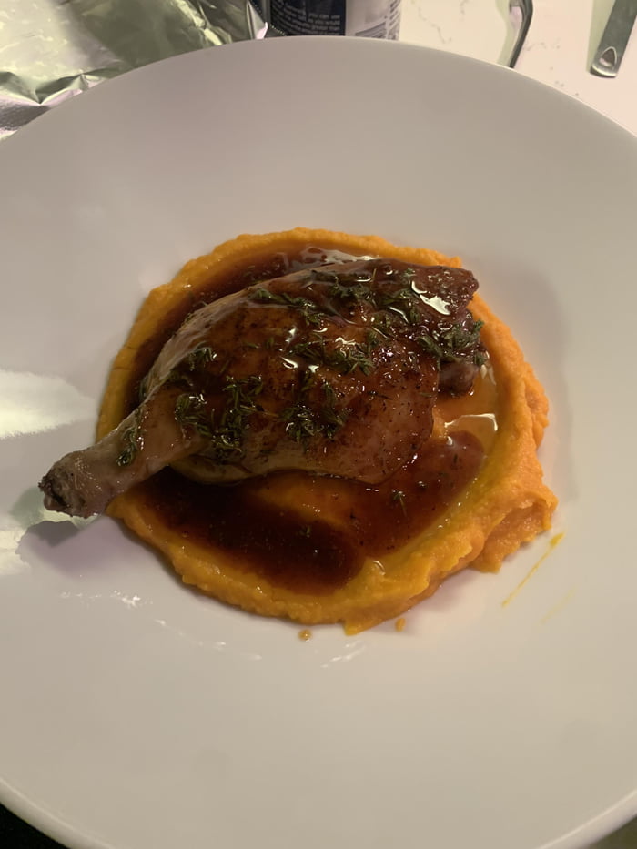 Maple-thyme glazed duck leg served over a sweet potato puree - 9GAG