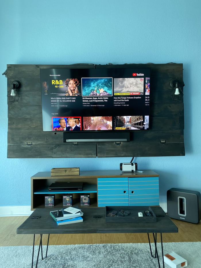 Custom made wall frame/mount for the TV and coffee table. Made from