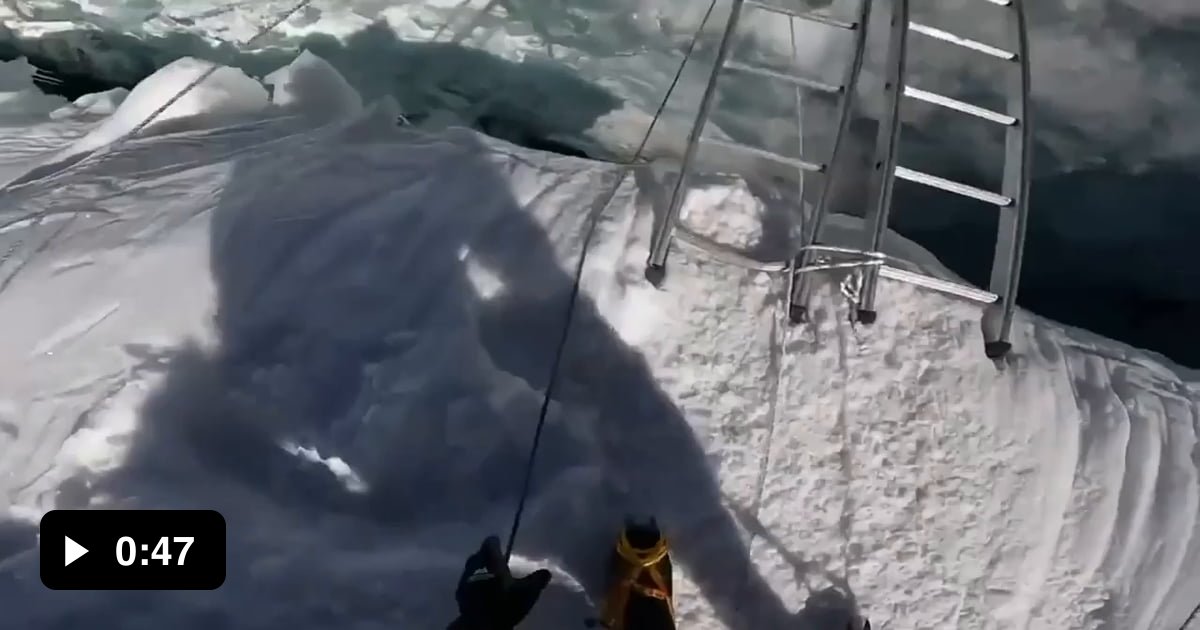 Crossing crevasses in The Khumbu Ice falls on Mt Everest, a slowly ...