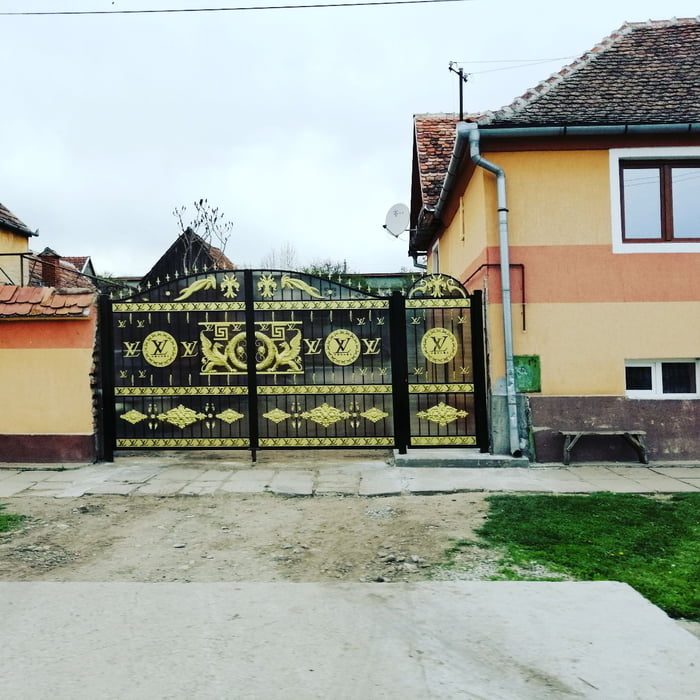 When you live in Romania, have no roads , no brain but bro.. your gate is Louis  Vuitton. - 9GAG