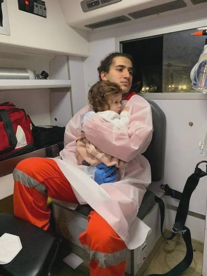 This girl was held by a red cross volunteer after she had lost her