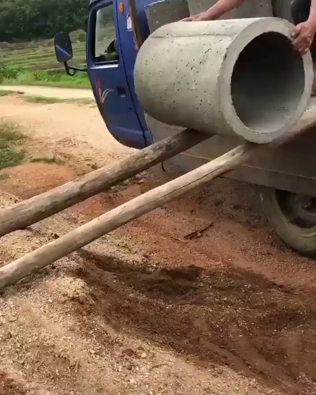 Unloading concrete pipes 9GAG