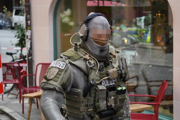 German SEK policeman (special police unit) in chainmail to counter ...