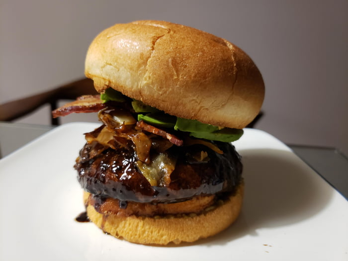 Halloumi and portobello burger with caramelized cabbage, bacon, avocado