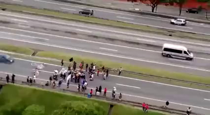 Group of assholes blocking the road