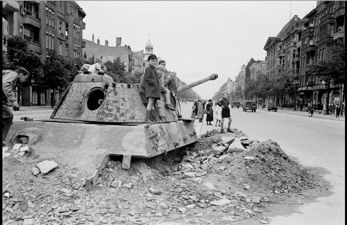 Children on a destroyed Panther tank shortly after WW2. - 9GAG