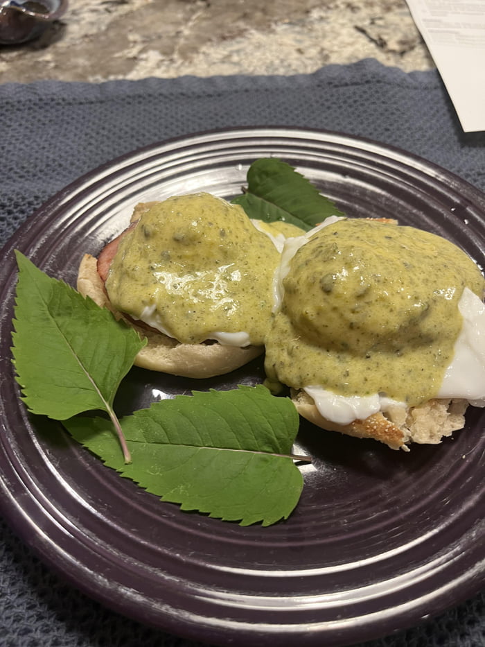 Bearnaise with roasted poblano over eggs Benedict. Dressed with