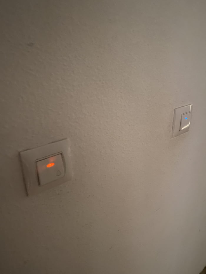 The button with orange led is the doorbell, the blue one is the light