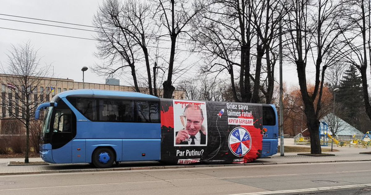 In Riga, Latvia, a bus parked in front of the Russian embassy offers to ...